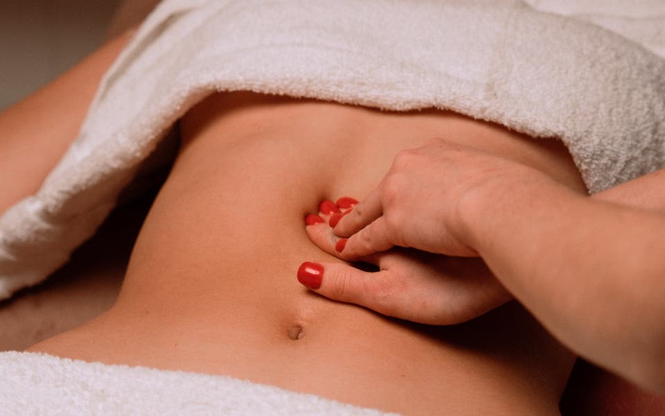 How to massage your way to a flatter stomach this Christmas