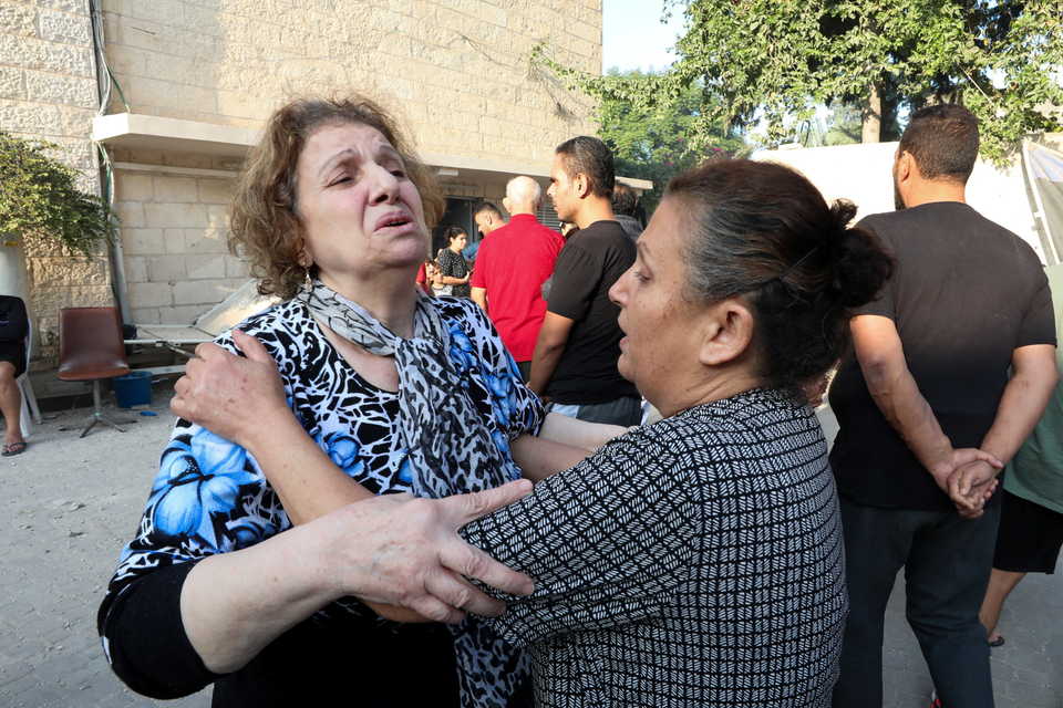 <p>Woman reacts at the Greek Orthodox Saint Porphyrius Church which was damaged by an Israeli strike</p>